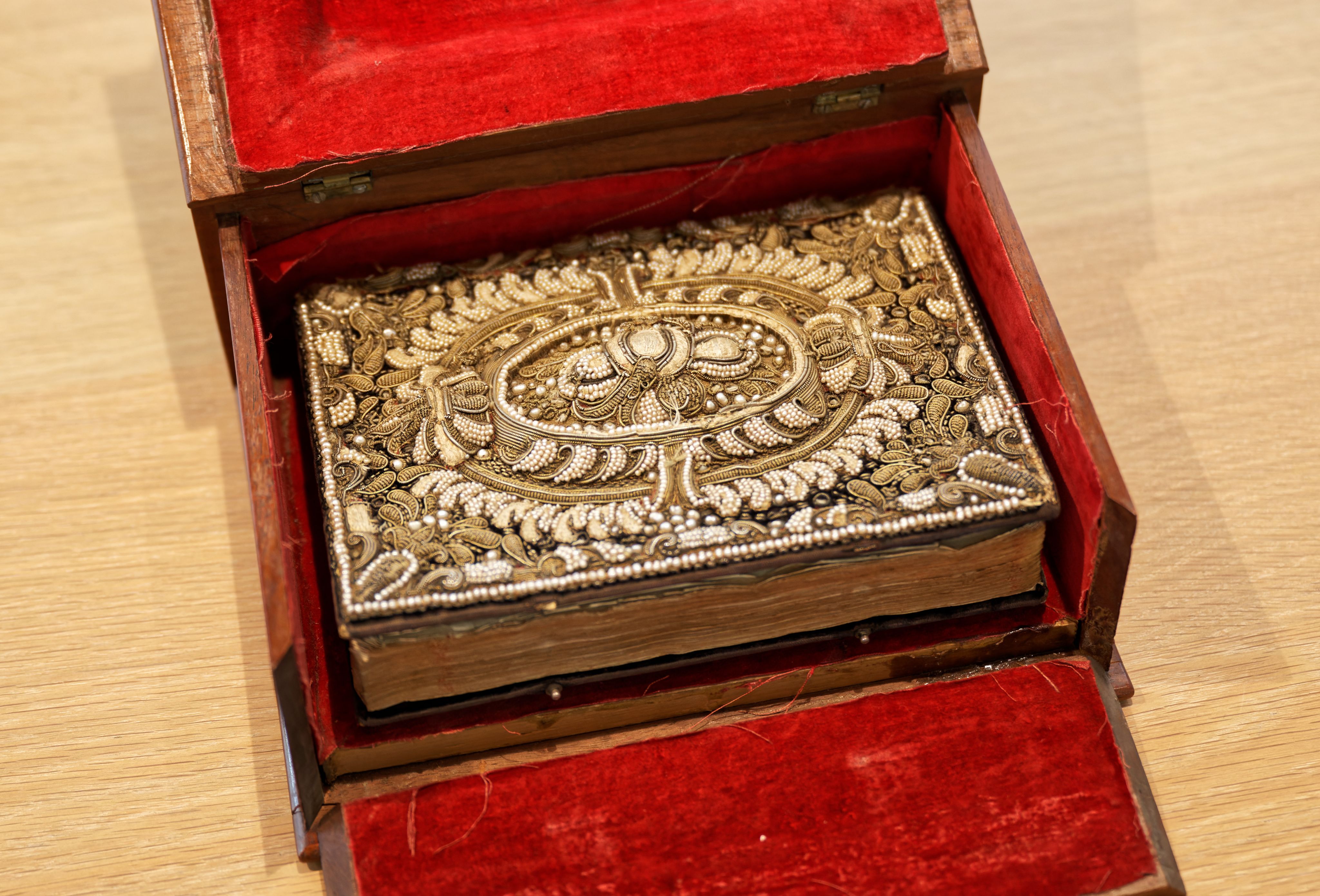 Decorative book with pearls and threads