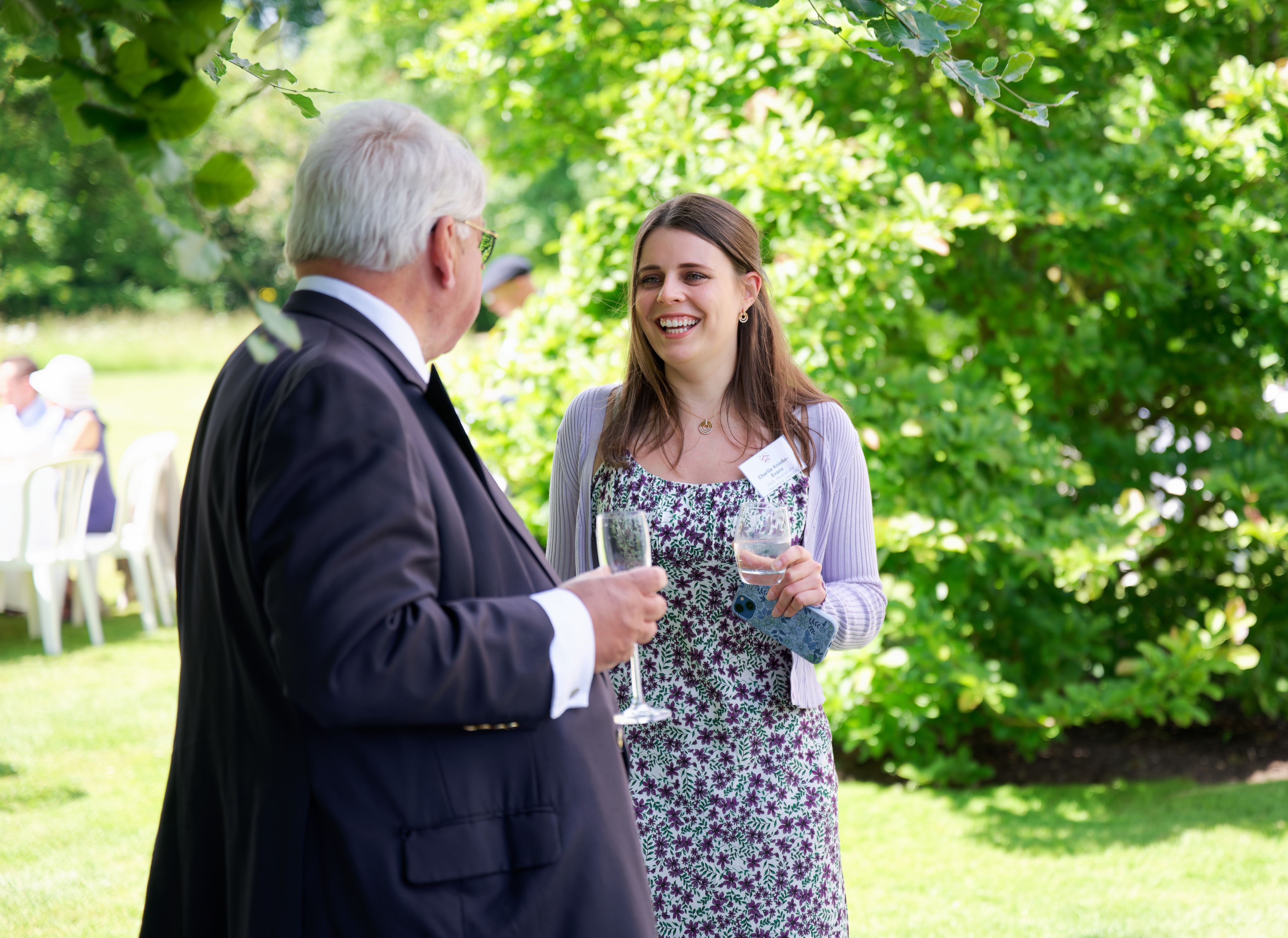 Old Member and current graduate student chat at the Donors' Garden Party
