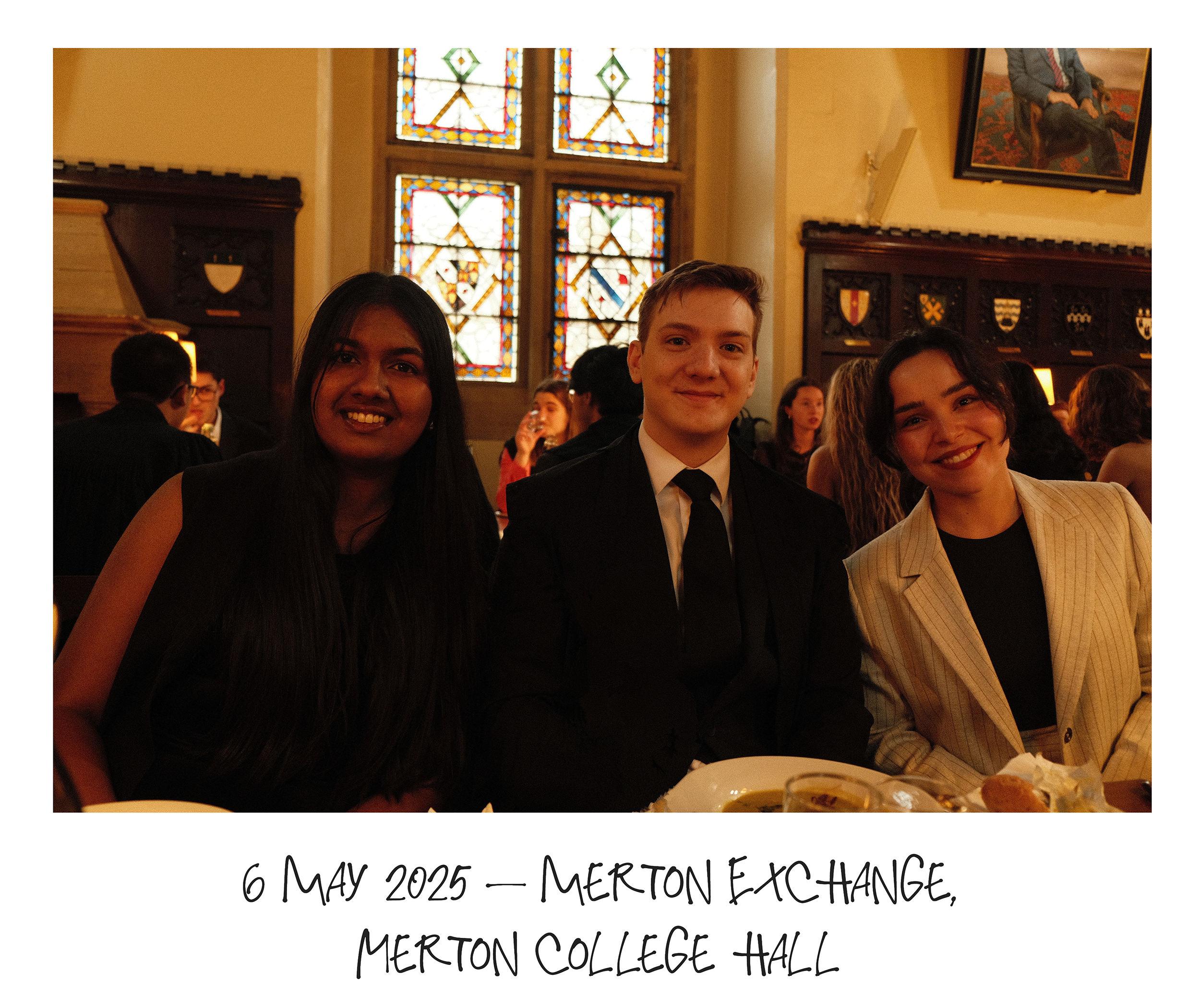 Three students at a formal dinner