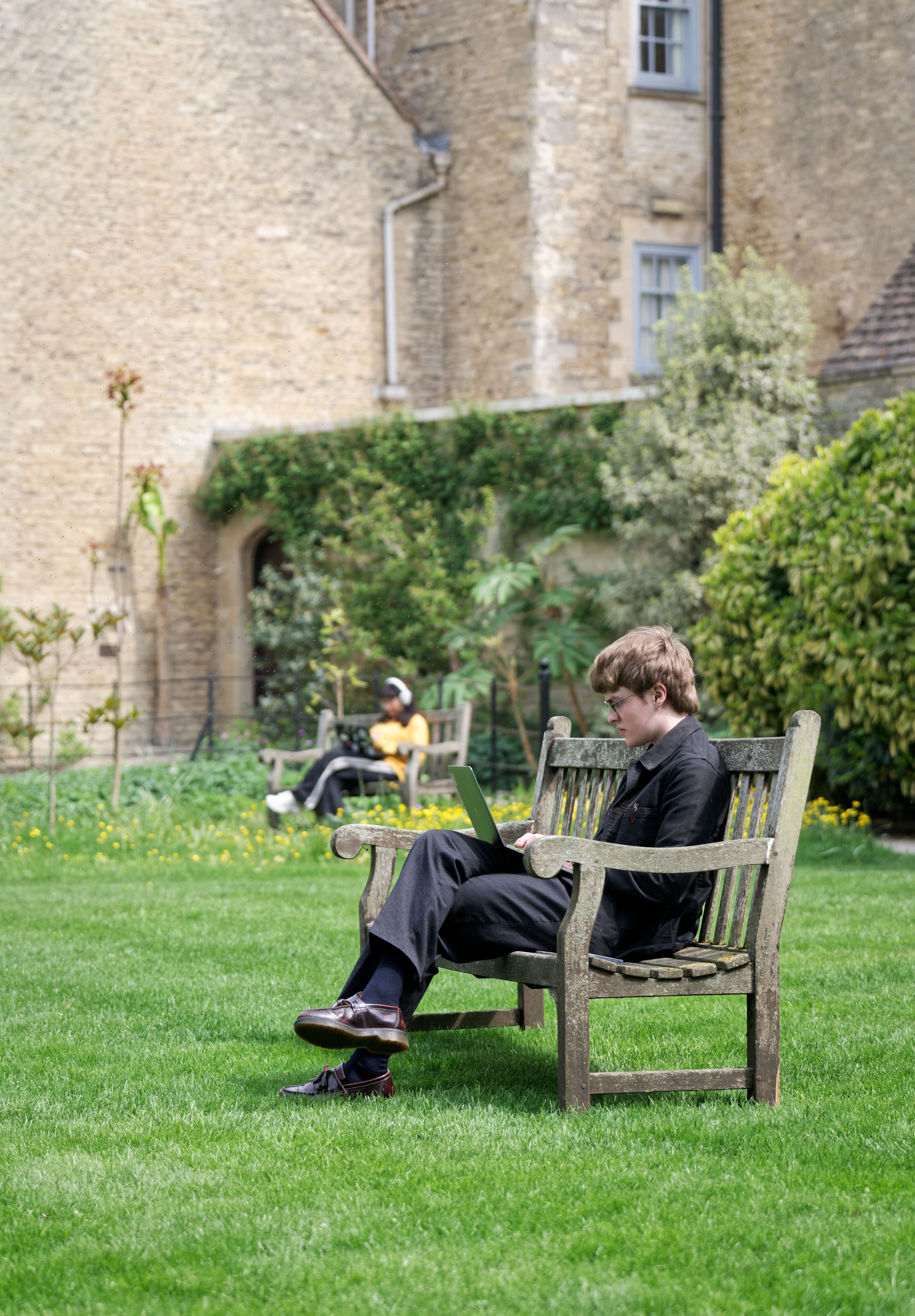 Two students work in garden