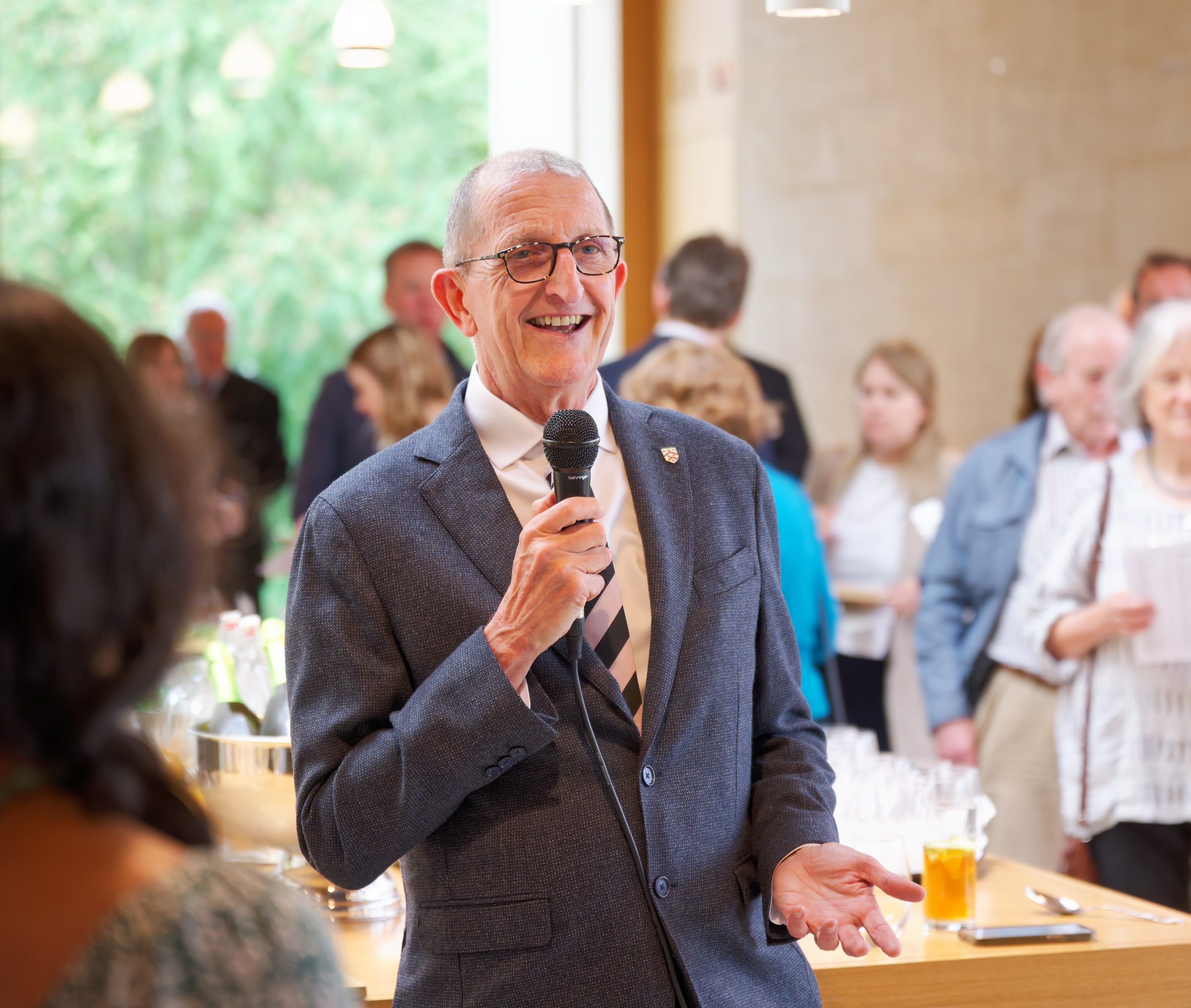 The Provost chats to two guests at a garden party